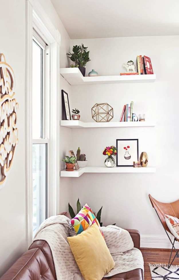 Corner shelves save space in tight quarters | 10 Space-Saving Apartment Living Room Ideas