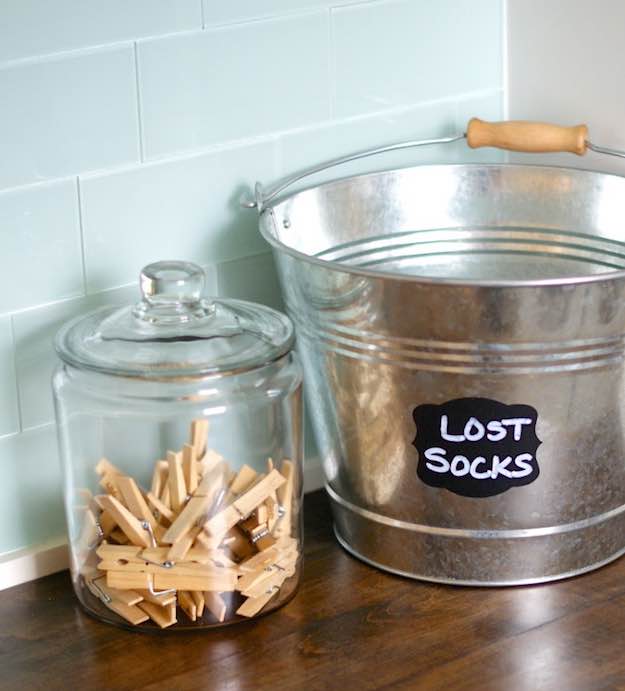 Labeled Jars and Buckets | 11 Practical Laundry Room Organization Hacks | Living Room Ideas