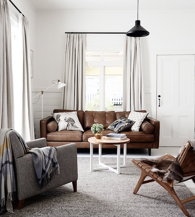 Clean White Walls | Chic Ways To Style A Brown Sofa In Your Living Room