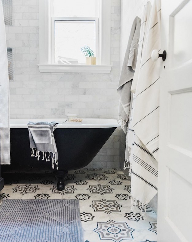 Add some prints | Apartment Bathroom Ideas To Steal For Your Space